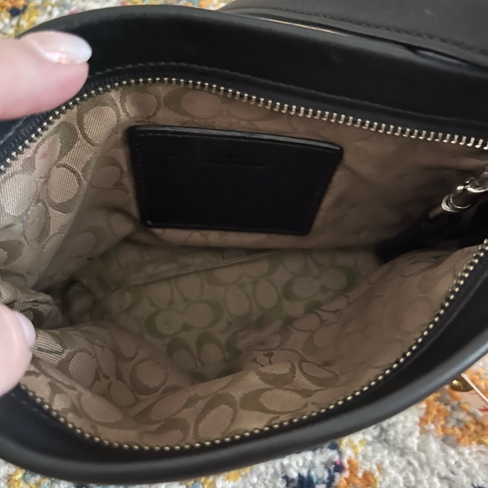 Black leather Coach Wristlet